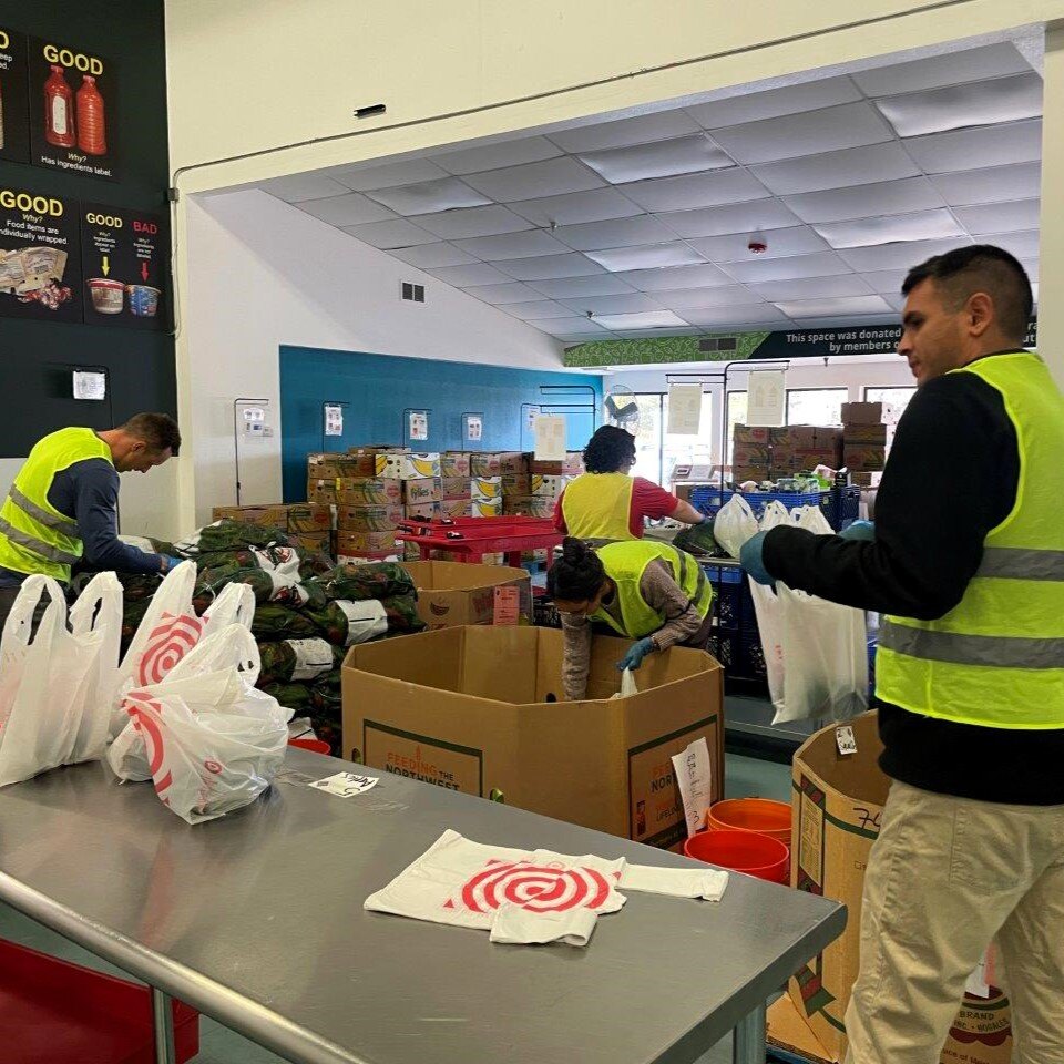 Flatirons Bank volunteers packing produce in bags