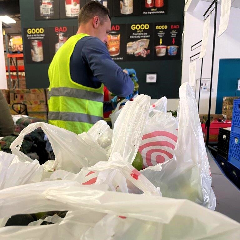 Flatirons Bank volunteers packing produce in bags